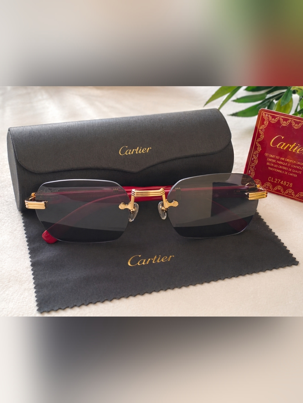 Cartier Gold Rimless Sunglasses with Black Lenses and Red Temples